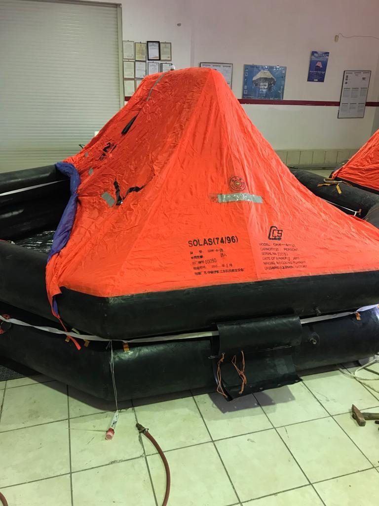 Inflated liferaft inside a service station