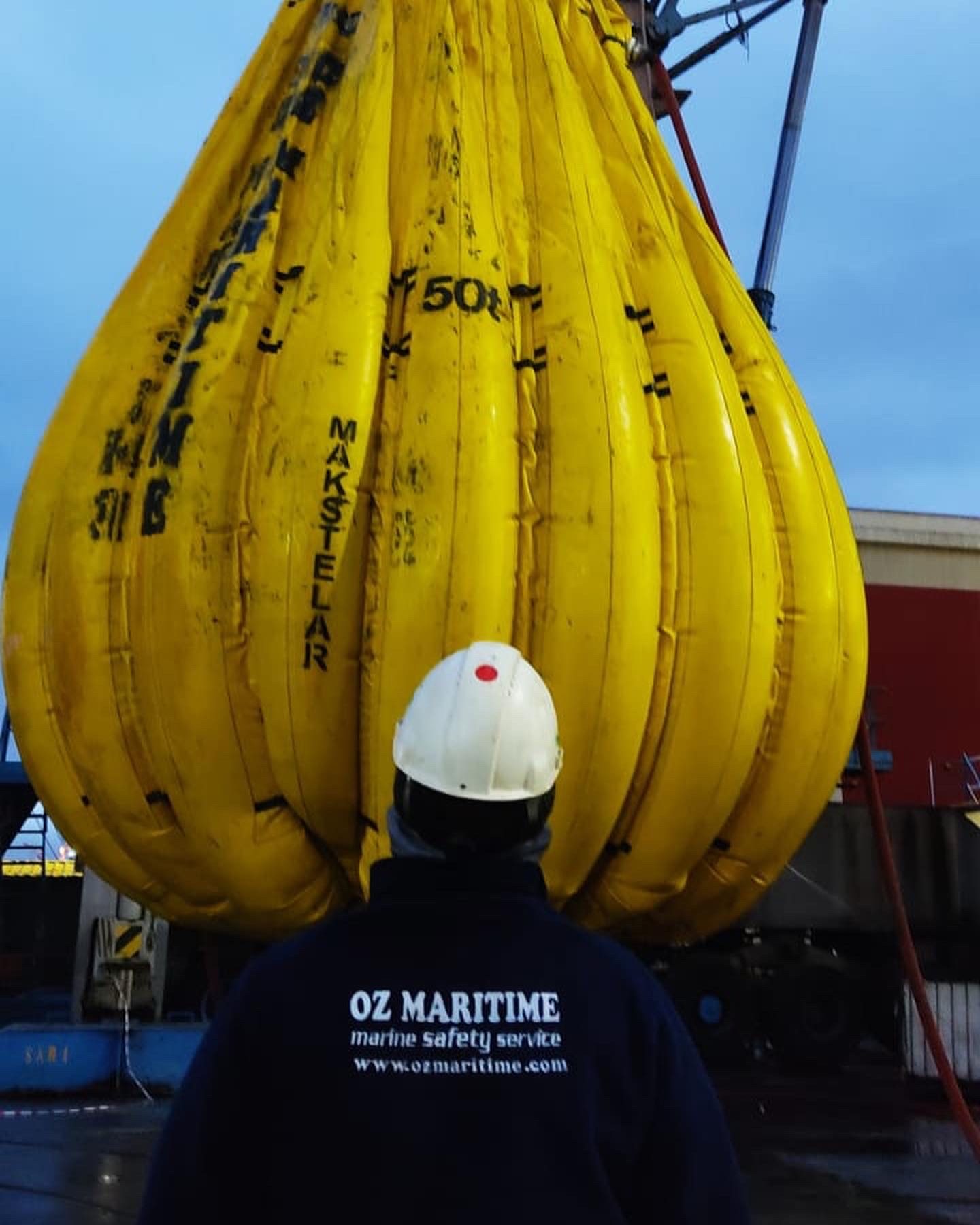Technician checking a suspended yellow test bag