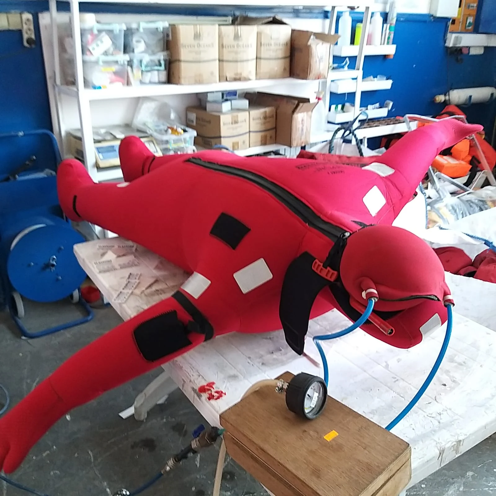 Inflated lifejacket under inspection at the service bench
