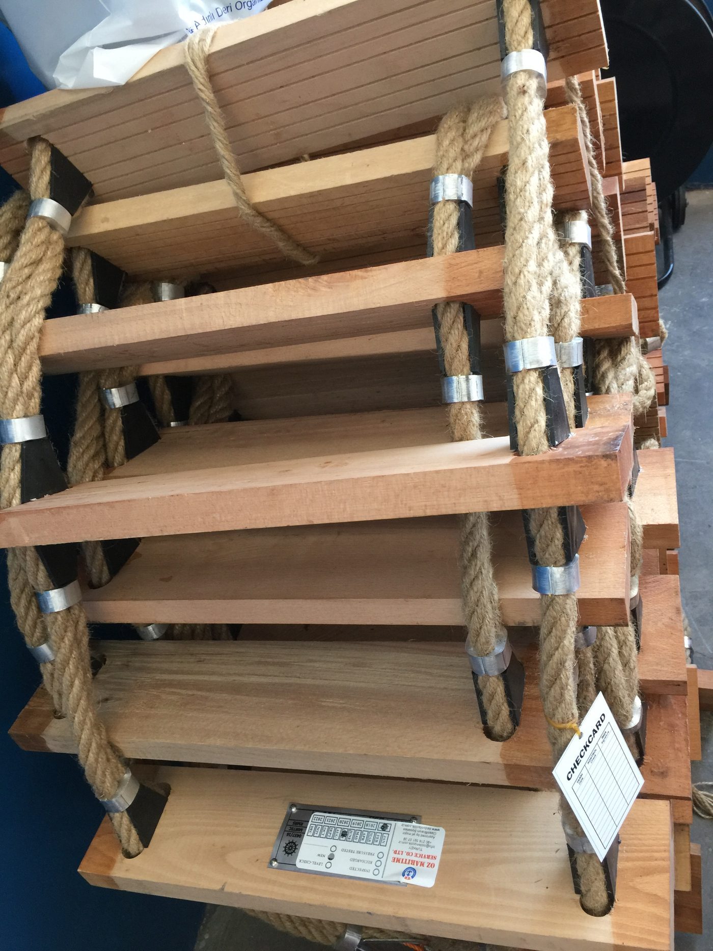 Packaged wooden ladder steps prepared for marine supply