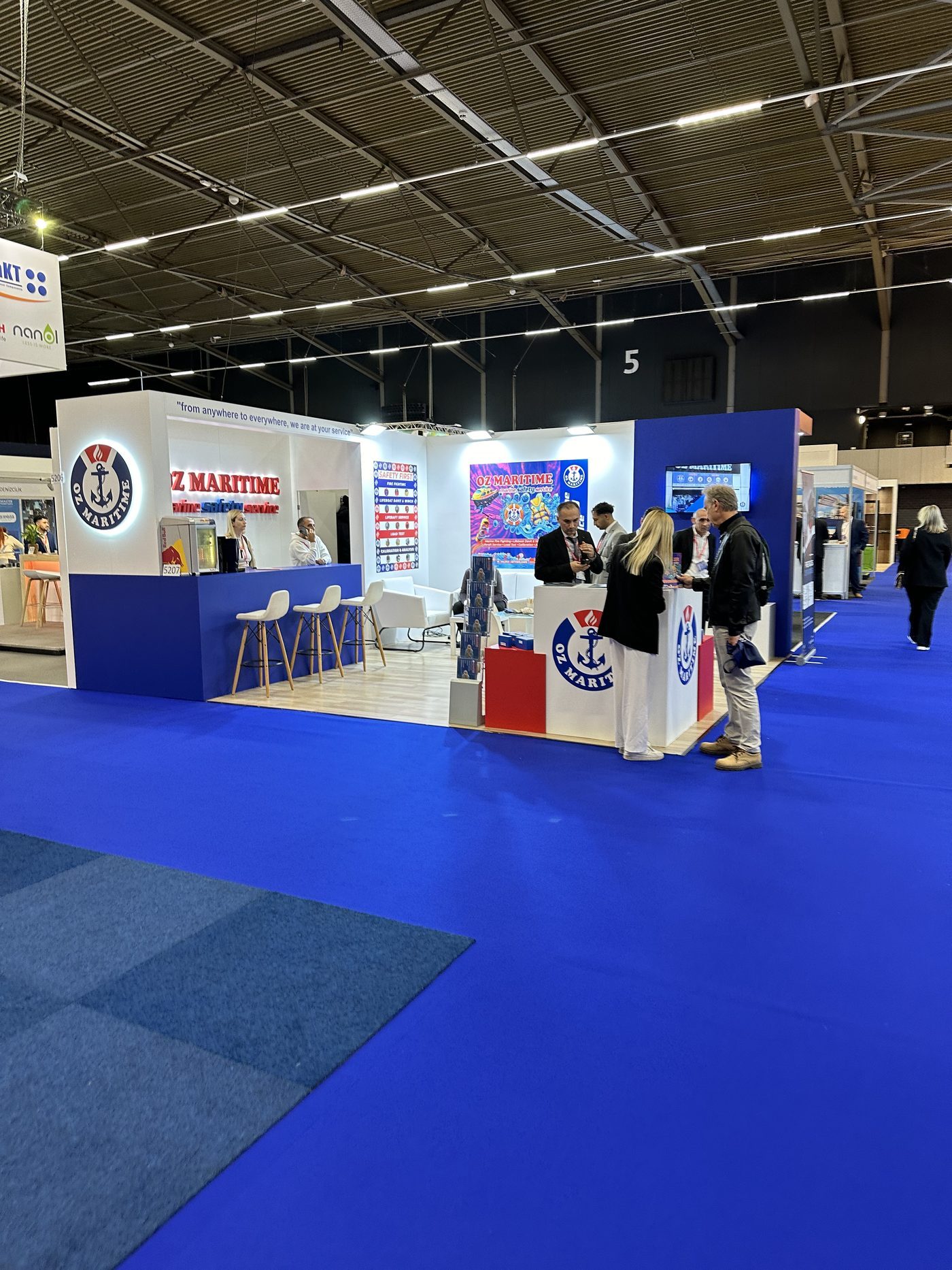 The OZ Maritime exhibition team at their maritime trade-show stand